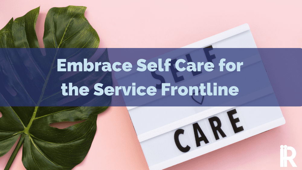 A sign saying Self Care with a banner across focusing on frontline service staff